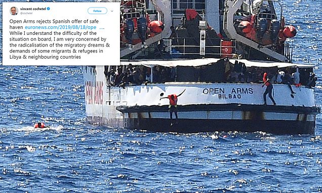 Migrants are being 'radicalised' by NGOs pushing them to raise their demands, warns UN refugee official after rescue ship trying to dock in Italy snubbed Spanish offer of asylum