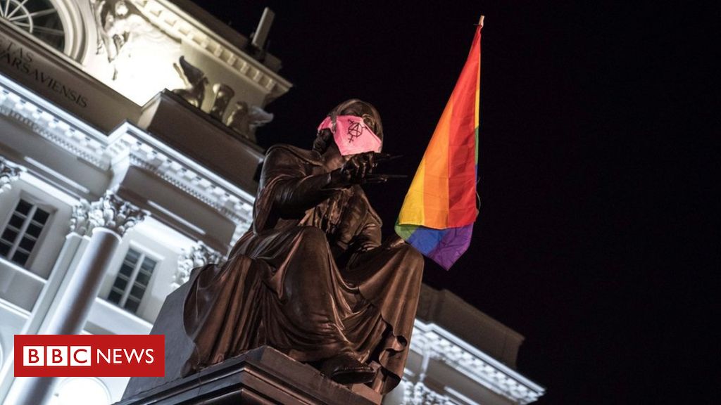 Poland LGBT protests: Three charged with hanging rainbow flags off statues