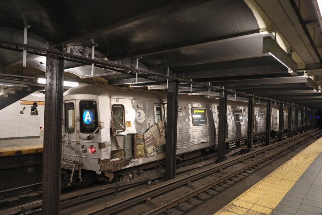 Subway train damaged, derailed after man allegedly throws debris onto tracks