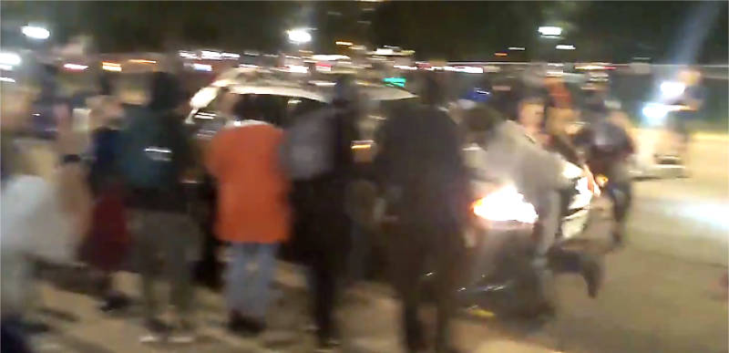 WATCH: Car plows through a group of BLM protesters after they surround vehicle in Denver!