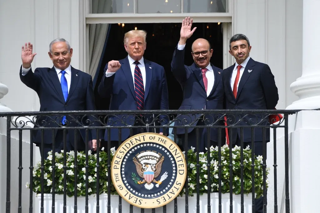 Israeli Prime Minister Benjamin Netanyahu, US President Donald Trump, Bahrain Foreign Minister Abdullatif al-Zayani, and UAE Foreign Minister Abdullah bin Zayed Al-Nahyan wave from the Truman Balcony at the White House in Washington, DC,
