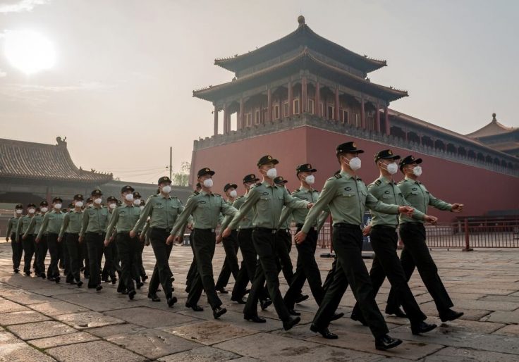 People's Liberation Army soldiers marching / Getty Images