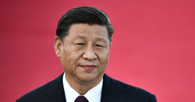 China's President Xi Jinping speaks upon his arrival at Macau's international airport in Macau on December 18, 2019