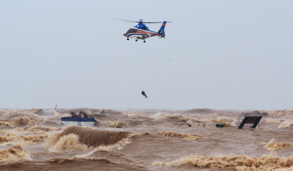 Military personnel rescue sailors of a ship at Cua Viet Port in Quang Tri province, Vietnam, on Oct. 11, 2020. (Ho Cau/VNA via Reuters)k