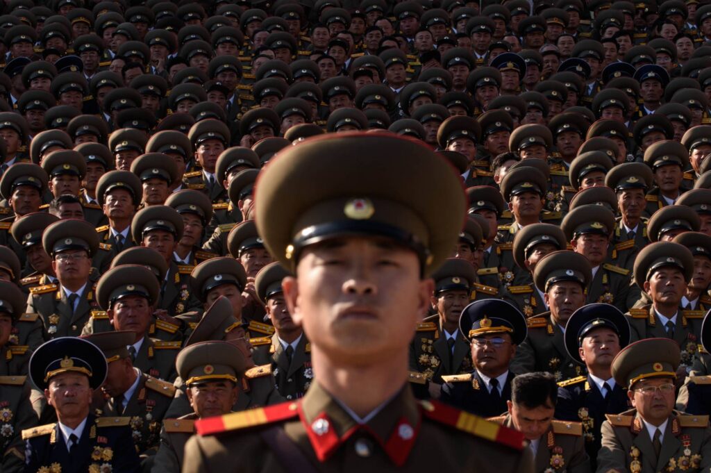 North Korean soldiers stand before spectators during a military parade in Pyongyang's Kim Il Sung square on Oct. 10, 2015. | AFP-JIJI