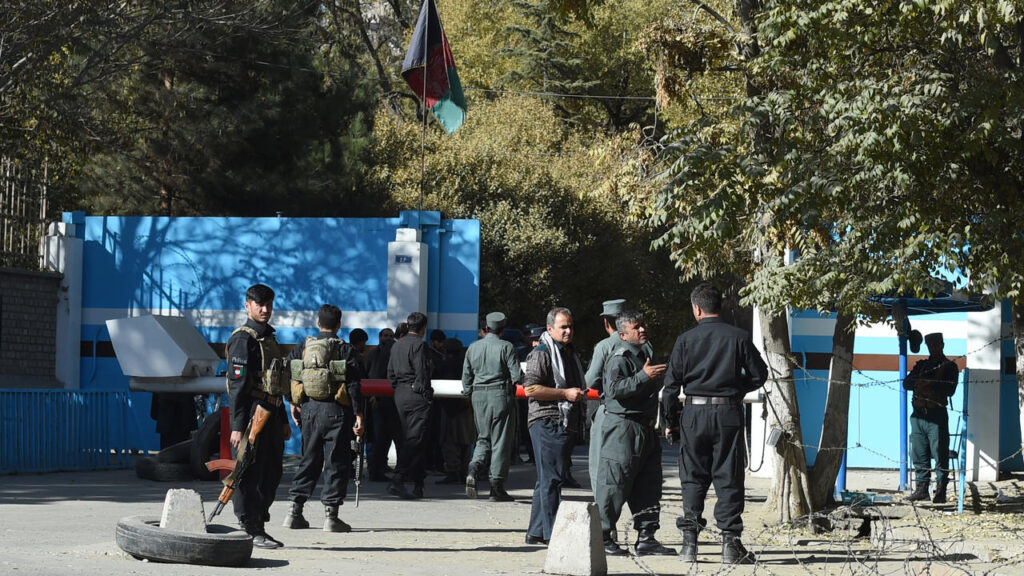 Police guard an entrance to Kabul University after gunmen stormed the campus WAKIL KOHSAR AFP