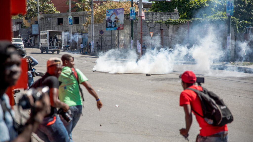 Haitian police fire tear gas on protesters in renewed clashes over disputed elections