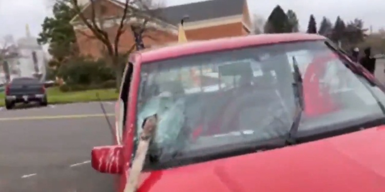 Antifa thugs in Washington vandalizing vehicles with American flags on them