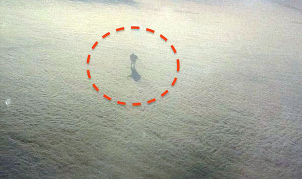 PICTURED: Crazy 'alien being' spotted cloud surfing from window of UK-bound plane