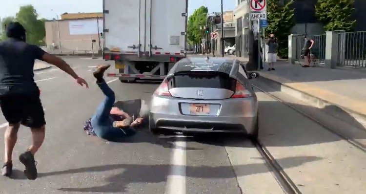 Anti-Police Protester Jumps on Hood of Driver’s Car in Portland – Driver Keeps Going, Tosses Antifa to the Ground! (VIDEO)