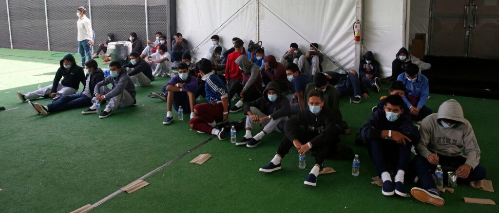 COVID-19 Outbreak At Migrant Facility Infects At Least 150 People