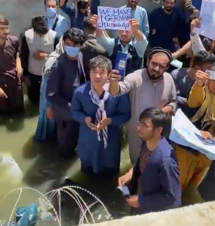 Biden’s Botched Withdrawal: Afghans Outside Kabul Airport Knee Deep in Sewage, Wave Their Papers, Begging to be Let In (VIDEO)
