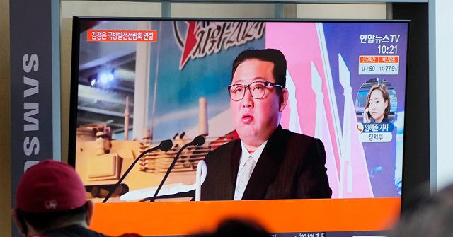 Kim Jong-un, Flanked by Missiles, Claims North Korea’s Enemy Is ‘War Itself’