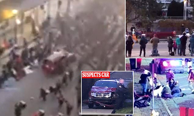 Driver of rampaging SUV that tore through Waukesha Christmas parade leaving at least FIVE dead and 40 injured was 'fleeing a knife crime': Cops hunt 'second suspect' after taking one person into custody and refuse to rule out terror