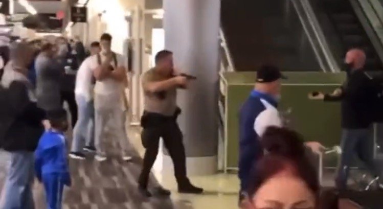 Massive Brawl Breaks Out at Miami Airport – Police Officer Brandishes Pistol After Mob Attacks Him (VIDEO)