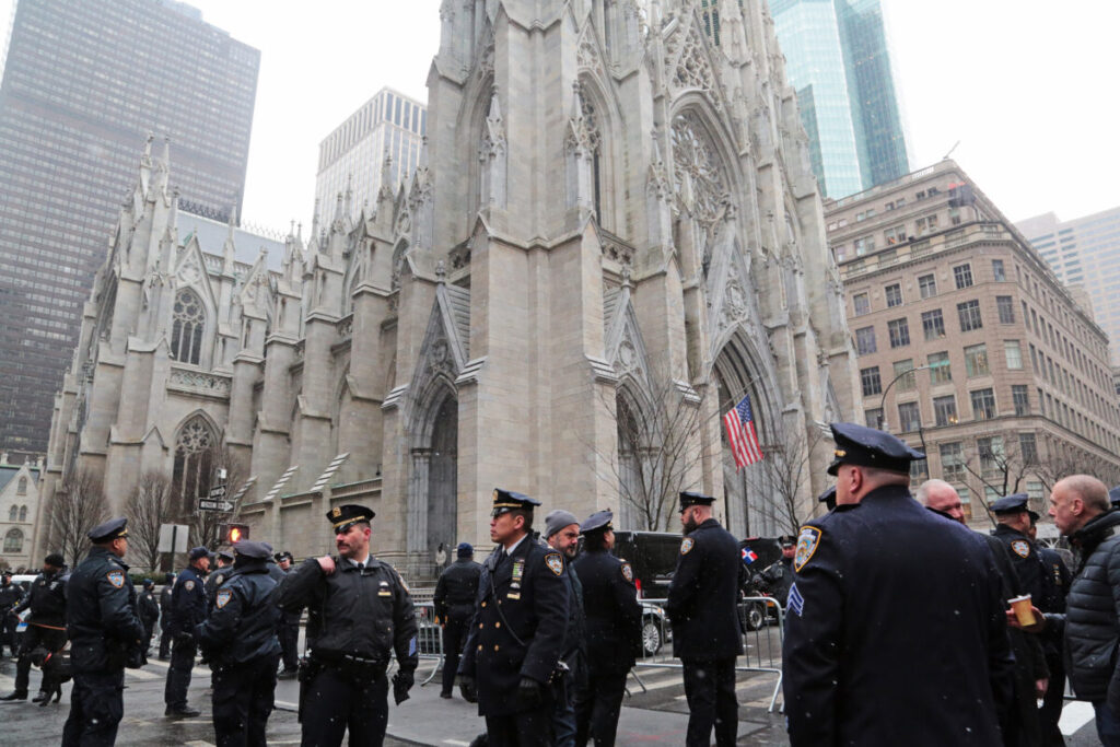 Thousands Attend Funeral for First of Two Slain NYPD Officers