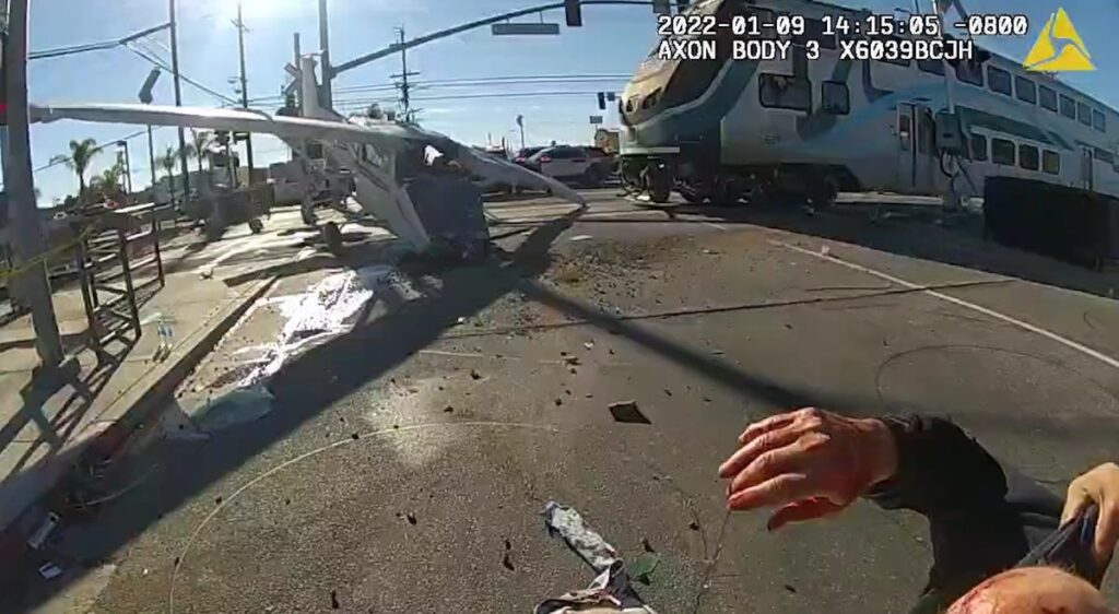 L.A. Police Pull Pilot Out Of Plane Stuck On Railroad Tracks Right As Train Hits It