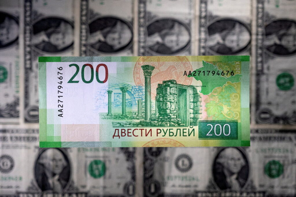 Russian Ruble Firms Past 57 to the Dollar for First Time in Four Years