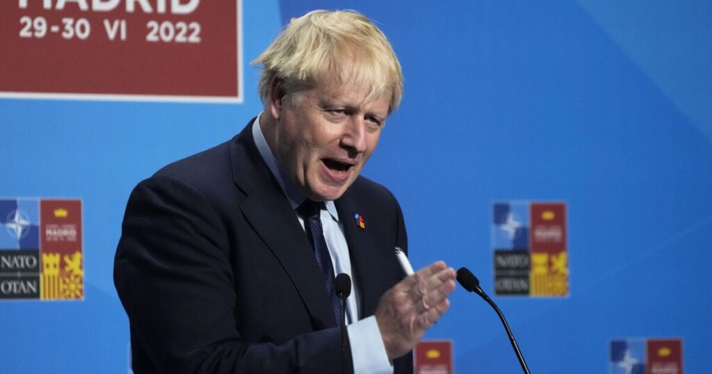 Boris Johnson fights for survival as top ministers resign