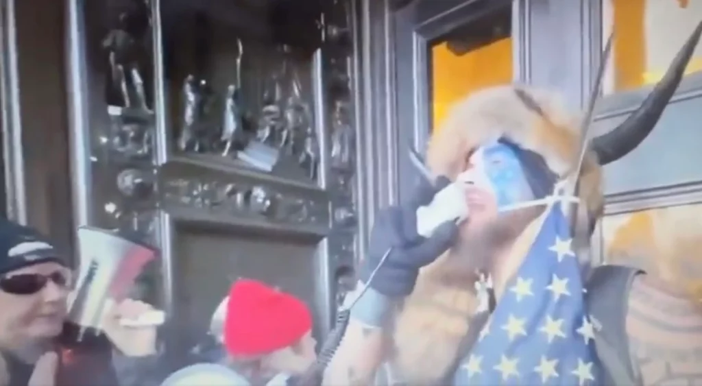 Video of Jacob Chansley “QAnon Shaman” Reading Trump’s Tweet to Protesters Resurfaces – Telling Them to “Go Home” and “Stay Peaceful”