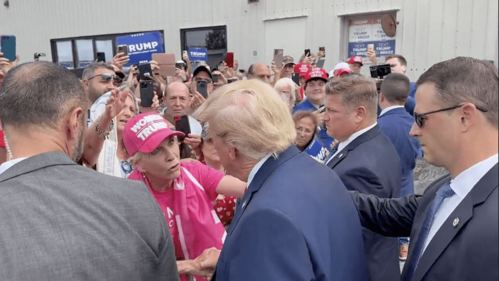 WATCH: President Trump Stops To Let Woman In Crowd Pray Over Him