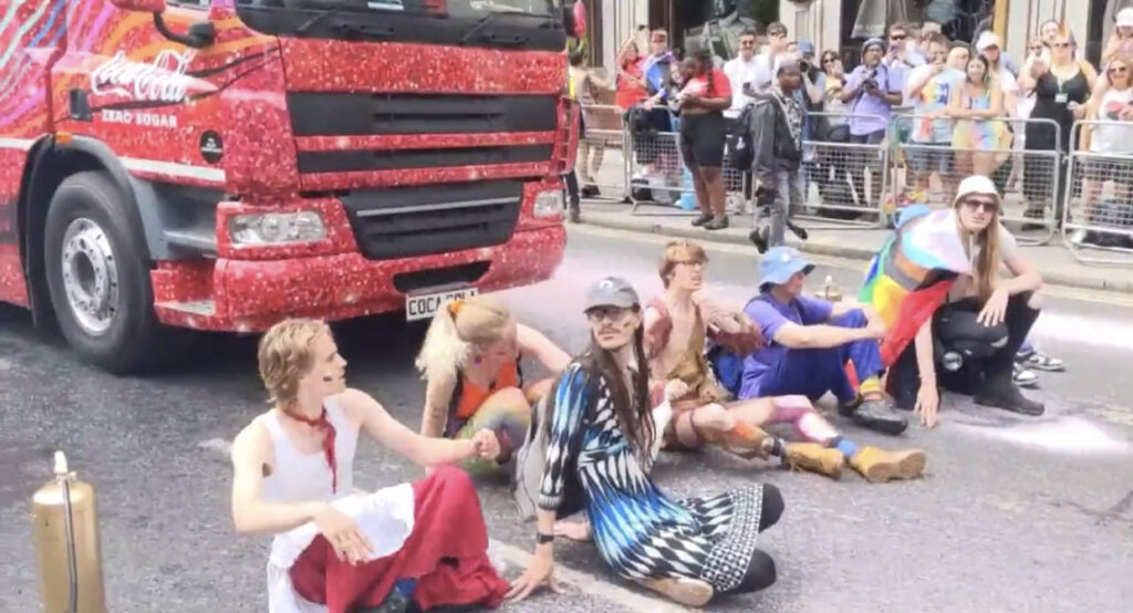 WOKE ON WOKE CRIME: Climate Activists Halt Pride Parade By Laying In Street