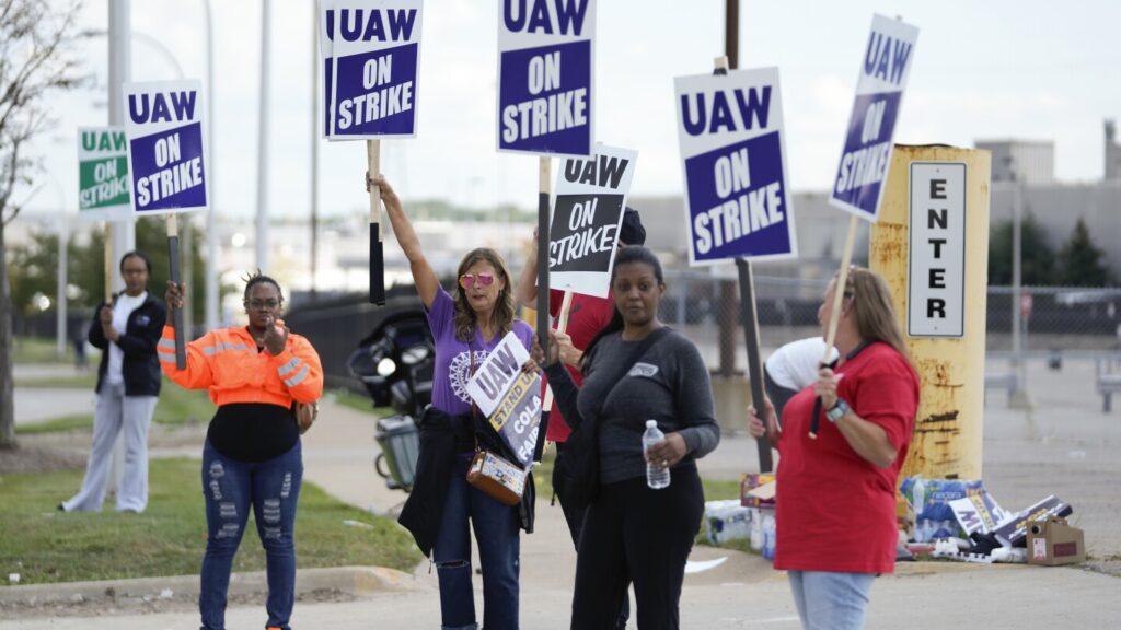 Workers strike at all 3 Detroit automakers in a battle for a bigger share of industry profits