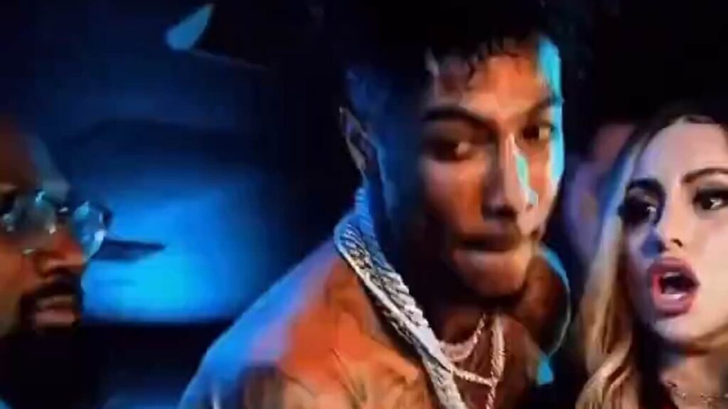 Shocking moment rapper Blueface calls fan up on stage then shoves her to the floor and tells his team 'get her' claiming she had thrown ice on stage