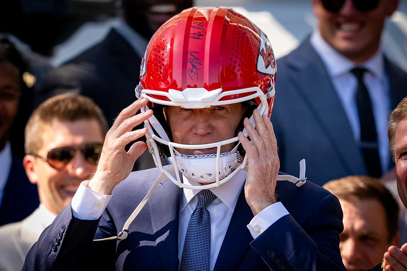Biden Puts On Kansas City Chiefs Helmet, Welcomes Team To WH