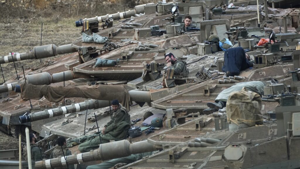 Iran says it fired dozens of missiles into Israel, where residents are warned to shelter in place