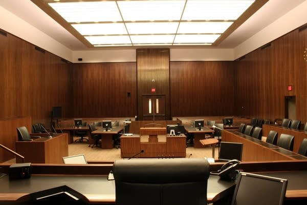 Empty courtroom with a judge’s gavel on a wooden desk, symbolizing a federal court ruling.
