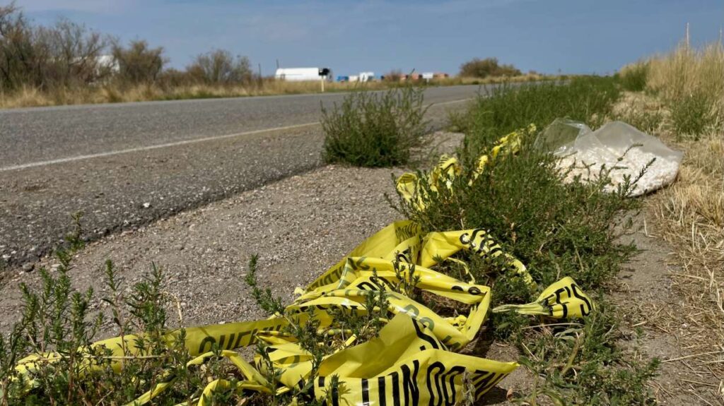 Law enforcement officers investigate a cordoned rural area in Utah where a child’s remains were discovered during a homicide investigation.