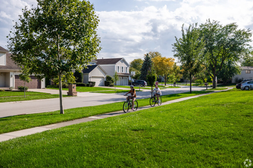 Quiet, clean neighborhood with kids on their bikes.