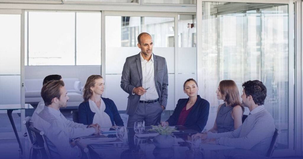 A formal policy meeting setting showing a physician and pharmaceutical executives in discussion, symbolizing negotiations over U.S. drug pricing during the Trump administration.