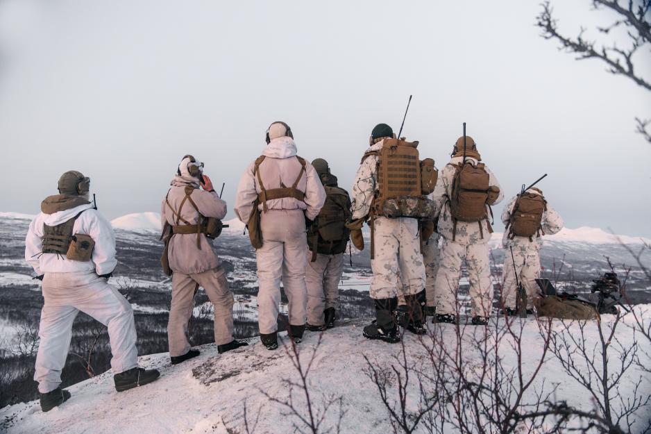 Norwegian military personnel conducting winter training in a cold Arctic environment amid concerns over equipment shortages.