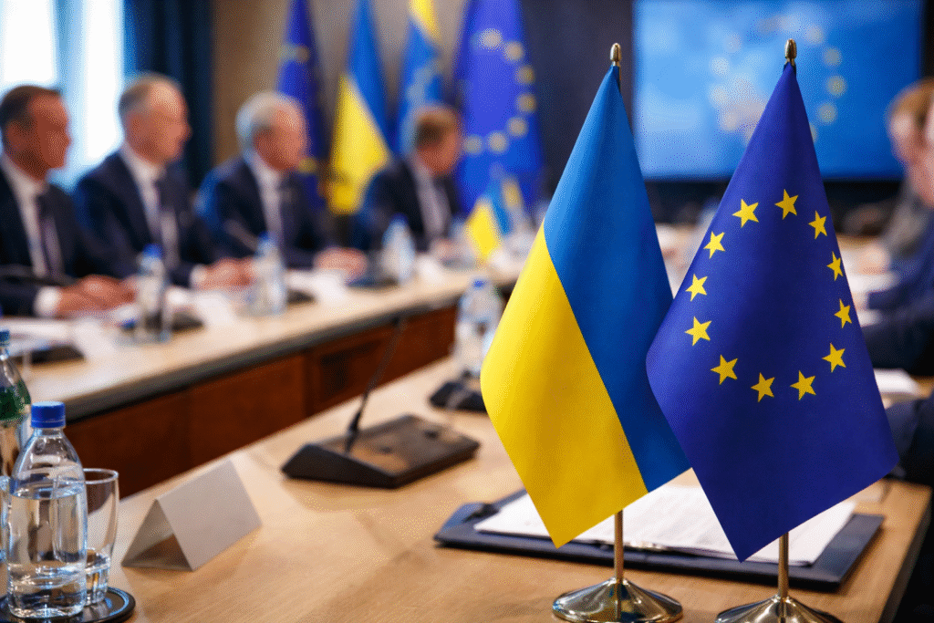 European Union and Ukraine flags displayed at a diplomatic meeting symbolizing discussions on limited EU membership for Ukraine.