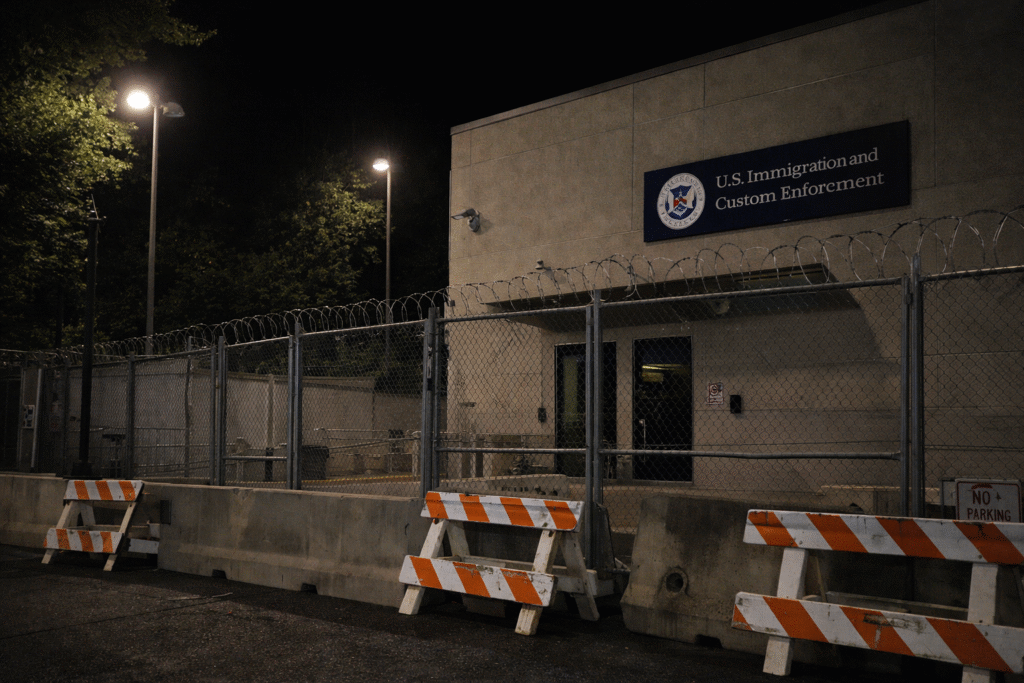 Exterior view of a federal immigration facility in Portland with security fencing, symbolizing a court ruling limiting crowd-control measures by federal agents.