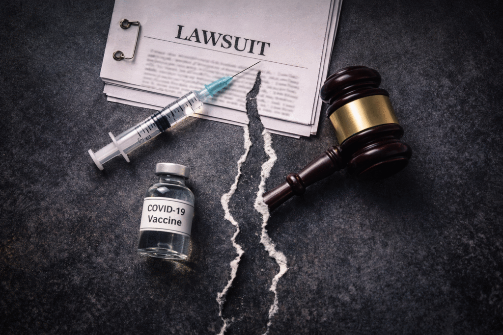 A conceptual image showing a split scene with a syringe and vaccine vial on one side and a judge’s gavel with legal documents on the other, separated by a visible crack symbolizing a legal conflict over vaccine-related issues.