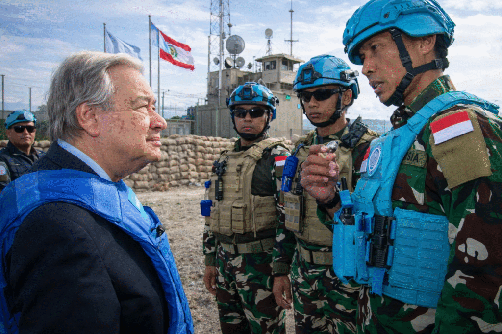 Interior of a formal international meeting hall with delegates seated, representing a United Nations-style setting during a diplomatic discussion.