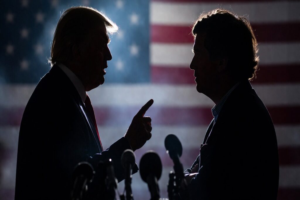 Silhouetted figures facing off in a tense political confrontation with a subdued American flag backdrop, symbolizing a public dispute.