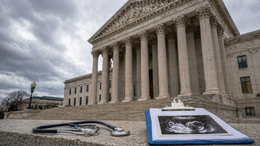 Courthouse building with classical columns under a cloudy sky, with a stethoscope and medical clipboard in the foreground symbolizing healthcare and legal policy