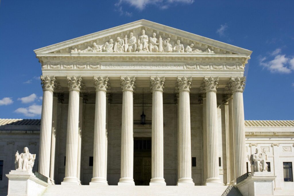 Exterior view of the U.S. Supreme Court building in Washington, D.C., representing a legal case involving immigration policy and Haitian TPS status.
