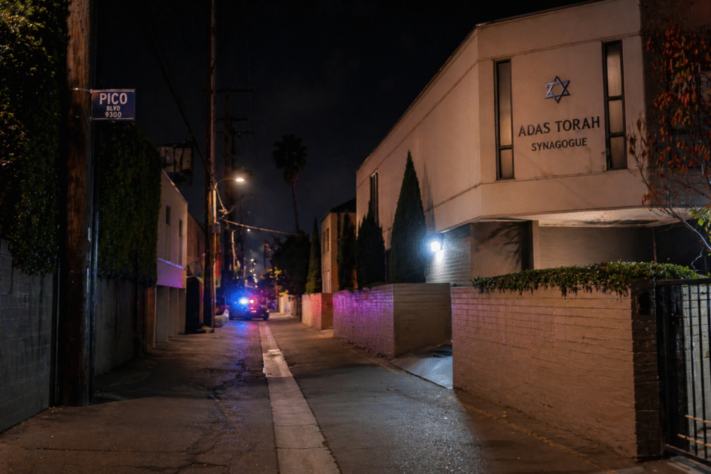 Dimly lit residential alley near a place of worship at night, representing a reported attack under investigation in Los Angeles.